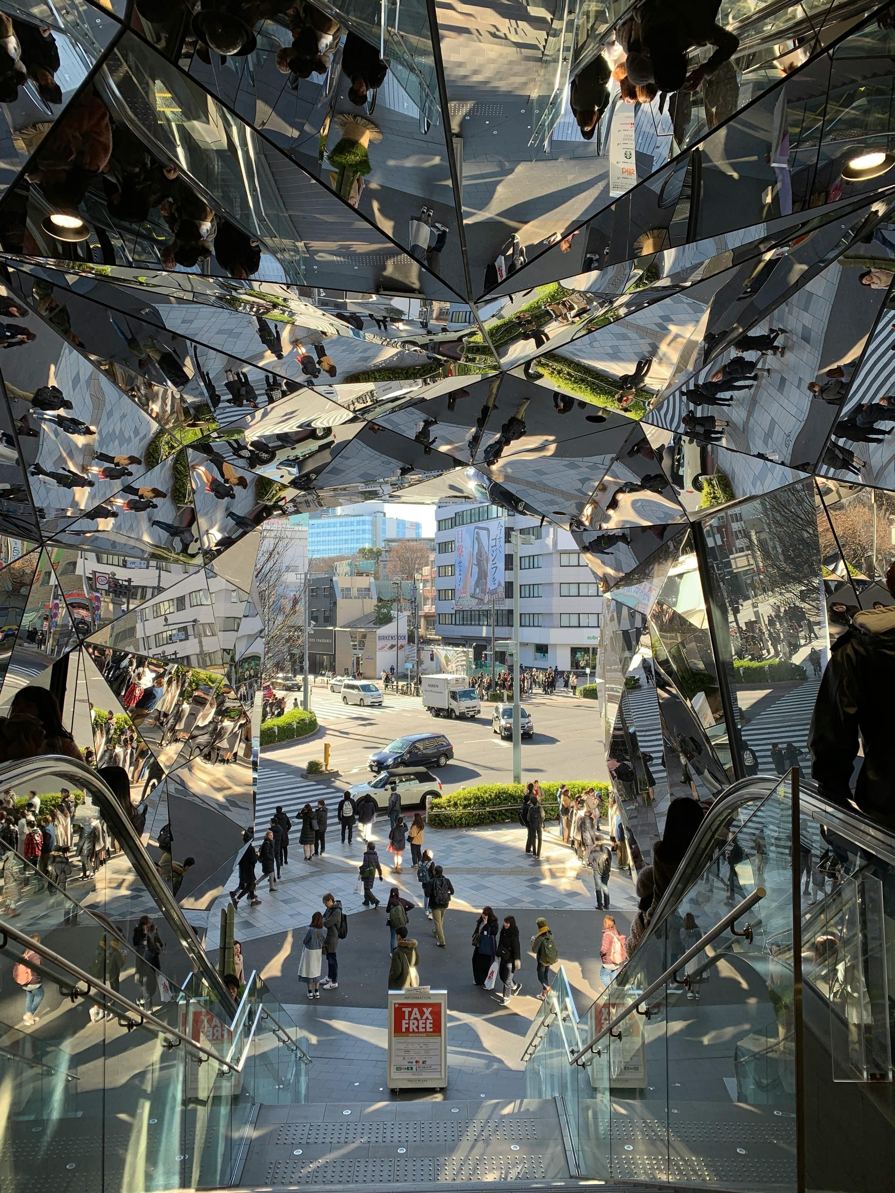 Harajuku Mall Entrance with Glass Mirrors Creating Curious Reflections and Shadows