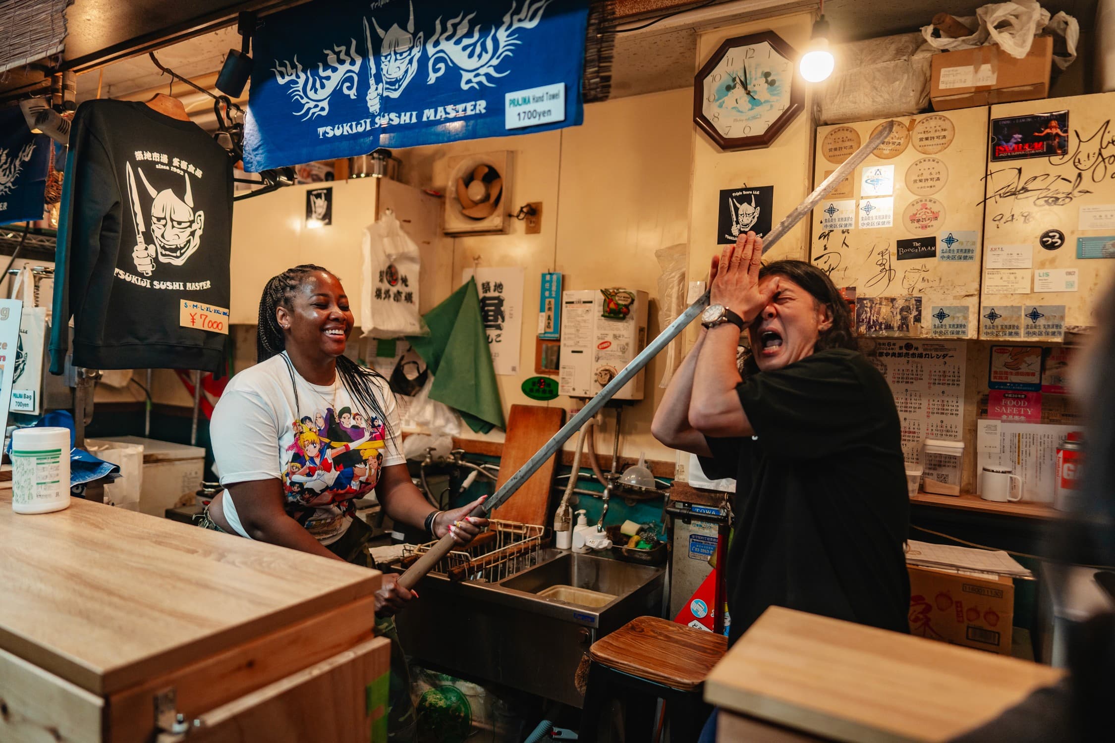 Hinomaru One Infinite Tokyo Private Tour Guests Holding Sushi Knife